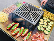 CUBY eldstad i svartlackerat stål med grillning av grönsaker och kött