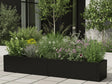 Blomlåda i svart stål med perenner och gräs